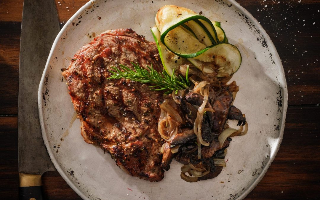 Grilled Veal Ribeye with Grill Sautéed Portobello Mushrooms & Onions