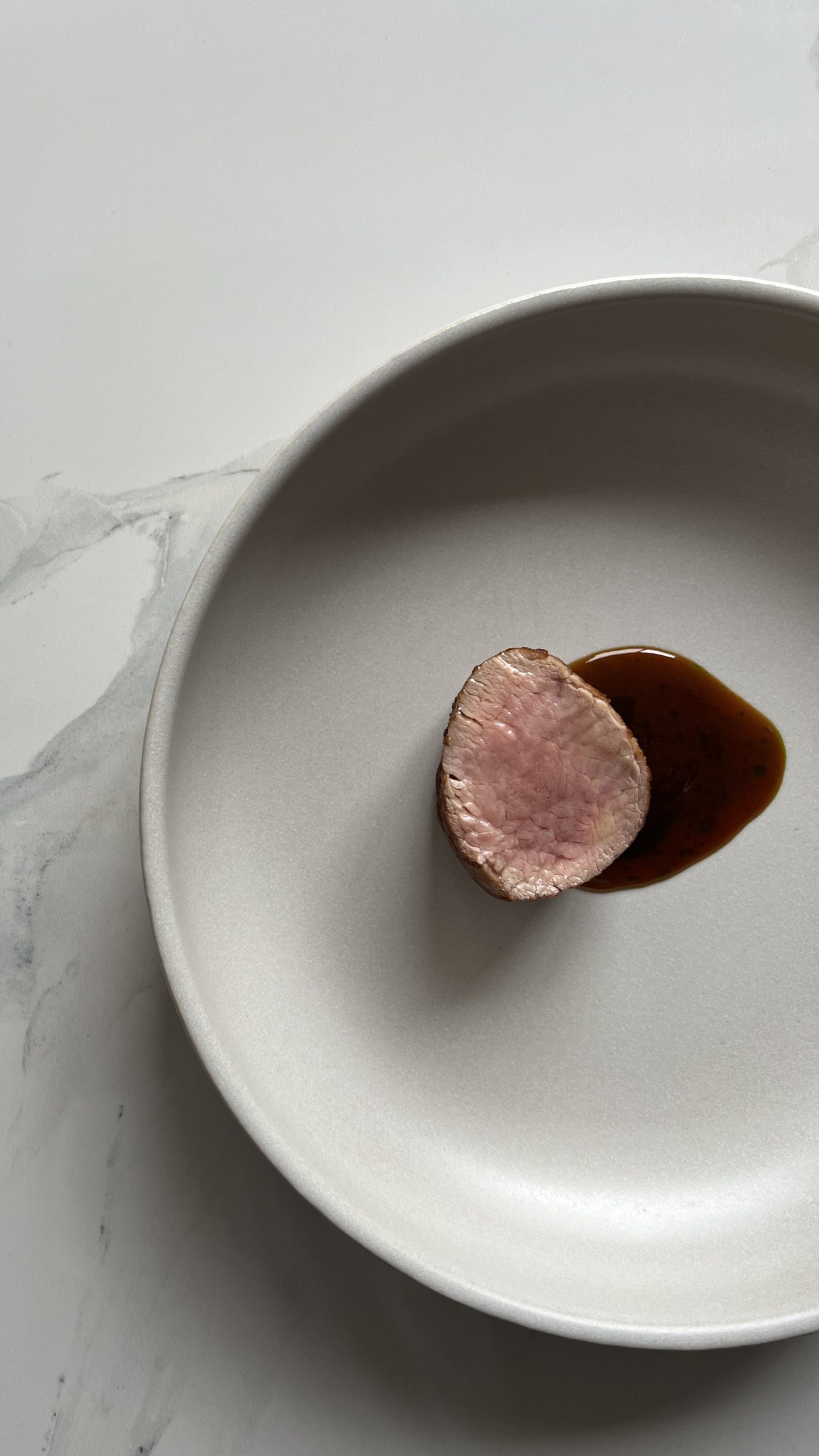 Pan Seared Veal Tenderloin with Tellicherryscented Veal Jus split with